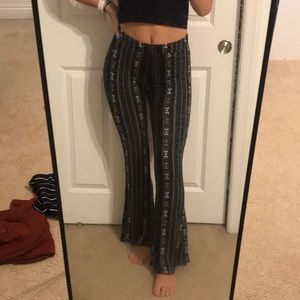 black, green, and pink flare pants